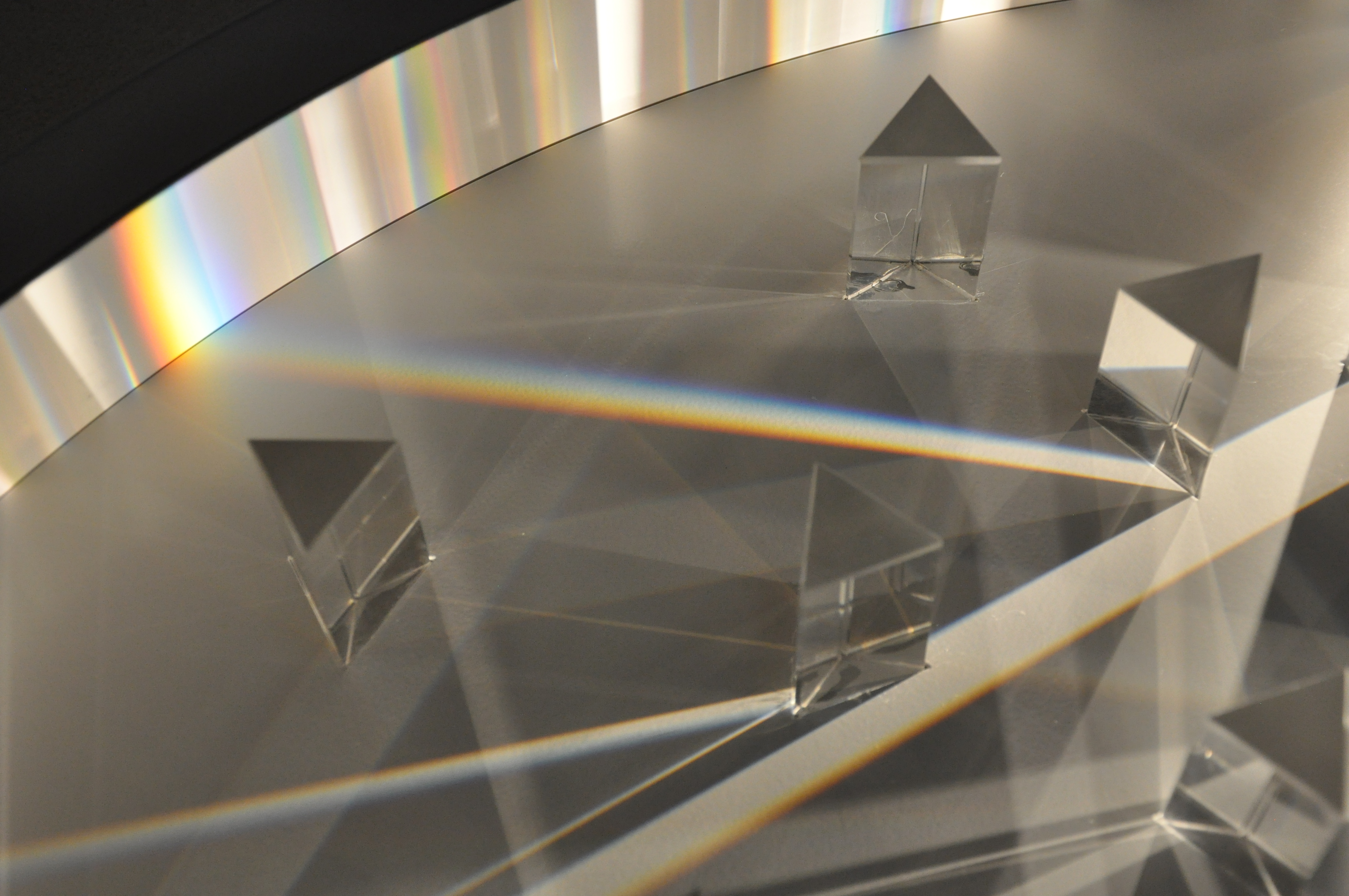 Private Commission — beams of light between prisms